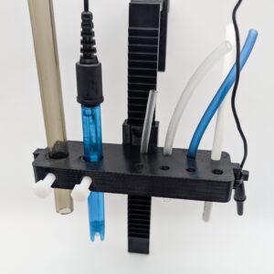 Reef Zip Hose Holder in black with several hoses demonstrated